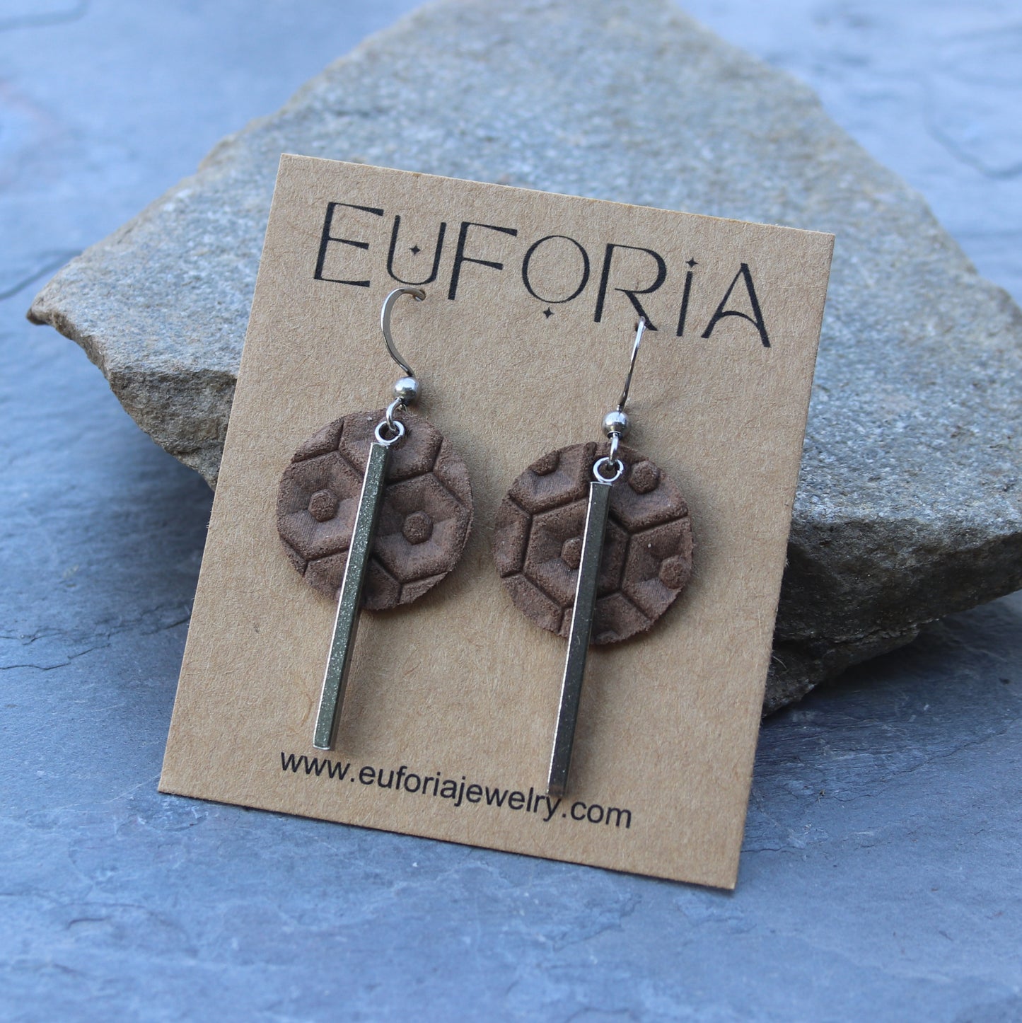 Light brown leather beehive pattern .75" circles with stainless bar charm dangle earrings