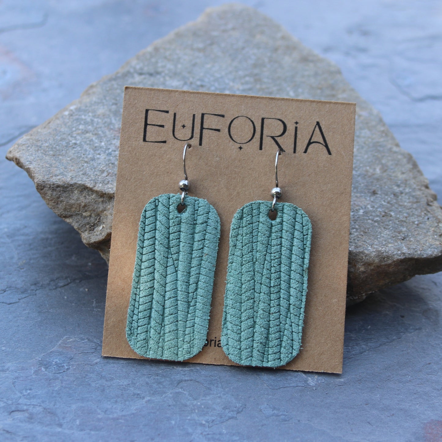 Seafoam leather barrel shaped earrings. Stainless ear wire, total length 2"