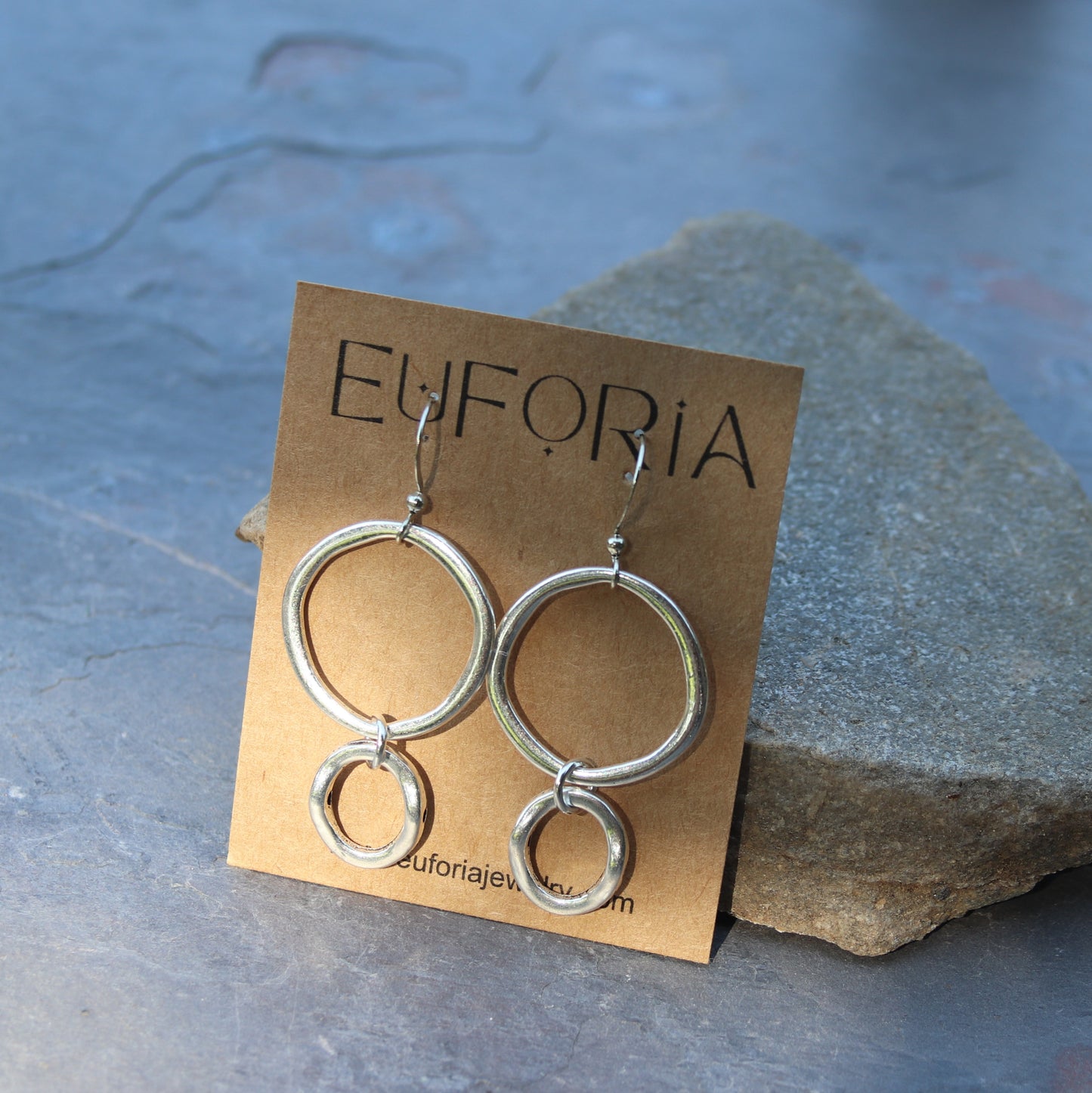 Organic silver plated open circle charm with open silver plated oval charm dangle earrings.   Circle charm is a touch under 1" wide OD. Stainless ear wires, total length 2.5"