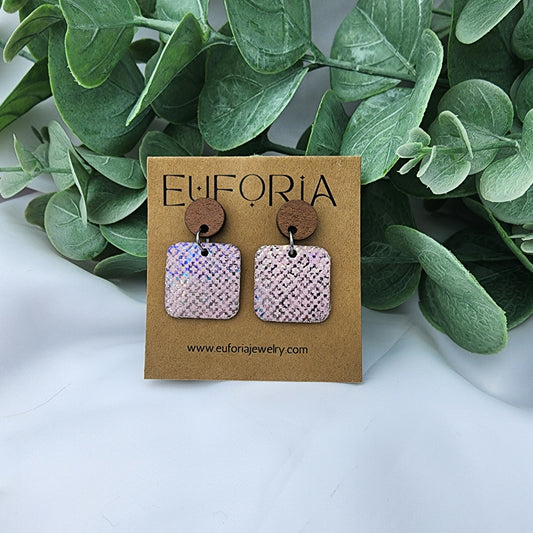 leather square earrings with round wood post. .75" squares in pale pink with iridescent overlay.
