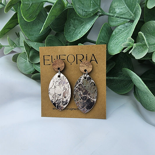 leather oval earrings with round wood post. 1.25" marquis in metallic rose gold cracked texture with