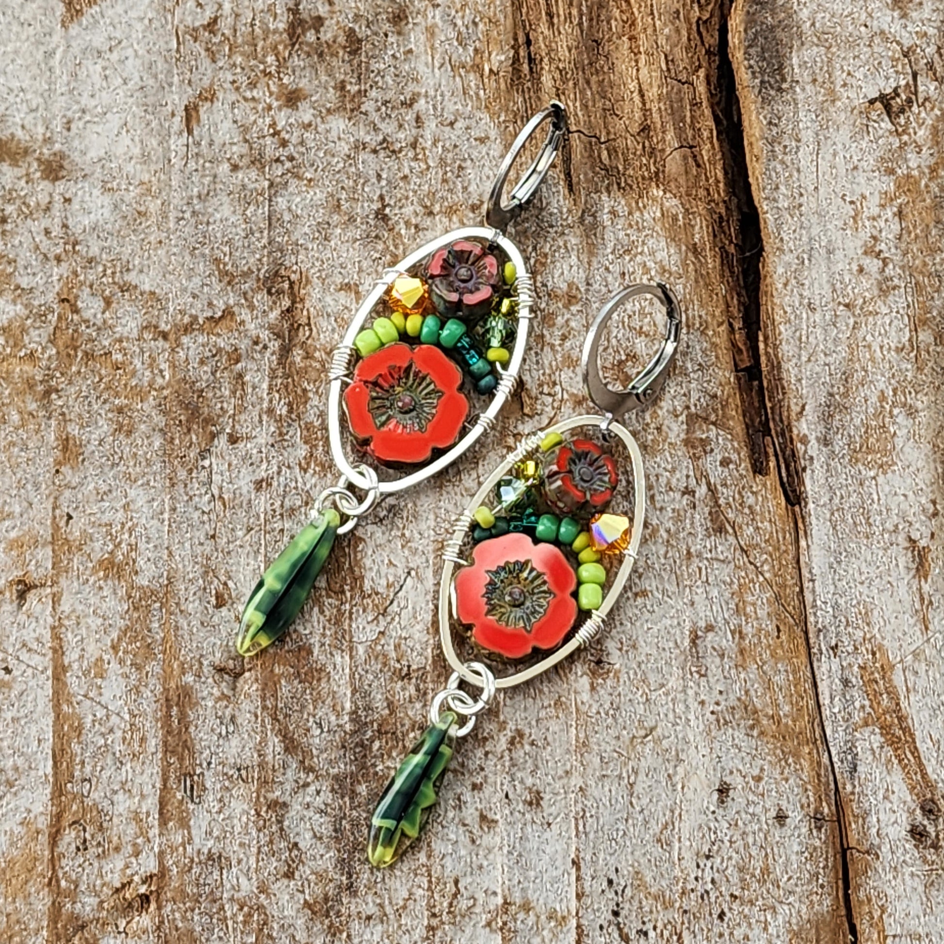 Dangle Earrings - Czech glass flowers, Swarovski, Japanese seed beads woven onto silver oval hoop. Stainless steel euro wires. Length about 2.25"