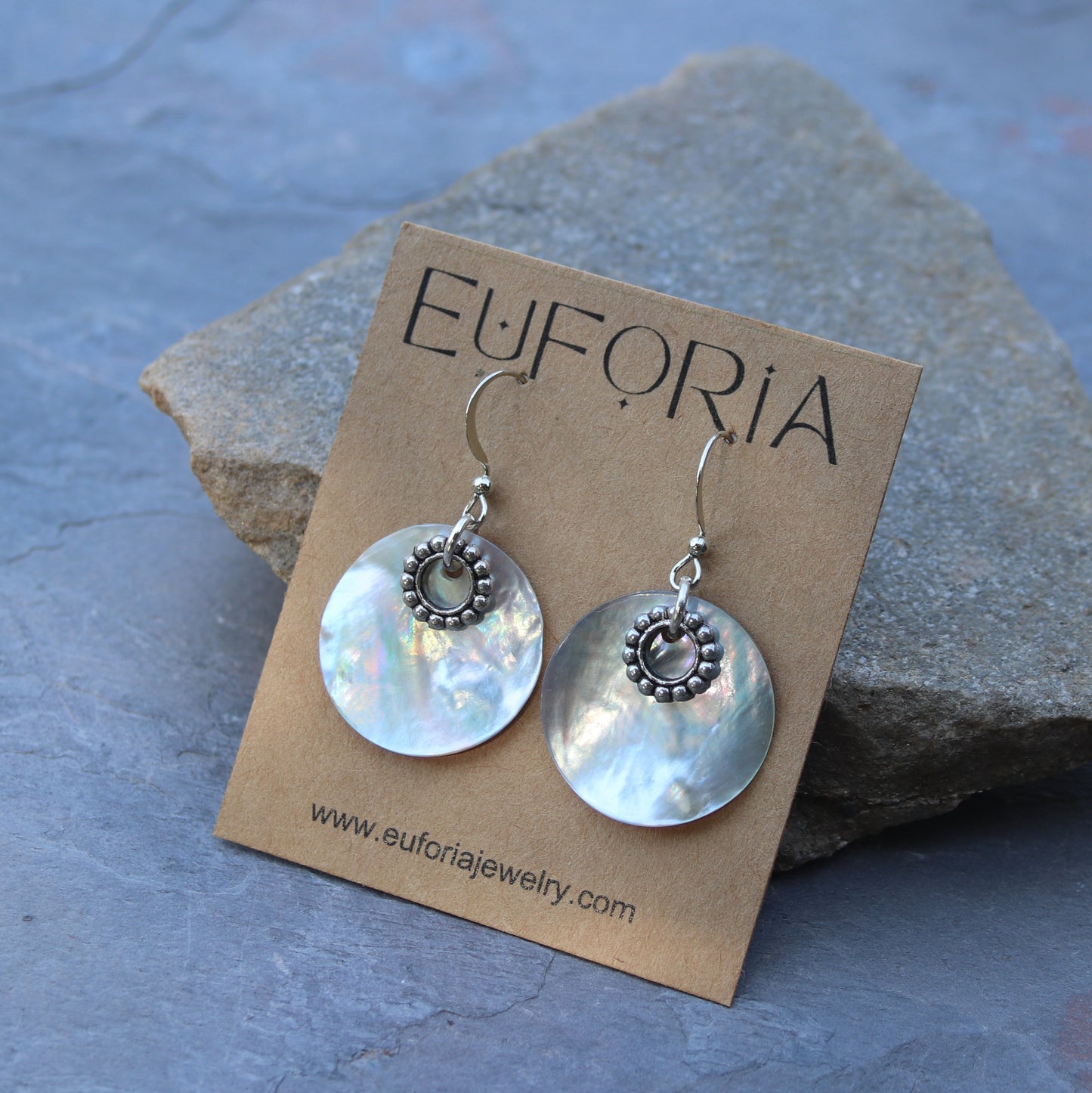7/8" natural shell disk with pewter circle charm earrings. Stainless ear wire. Total length 1.5"