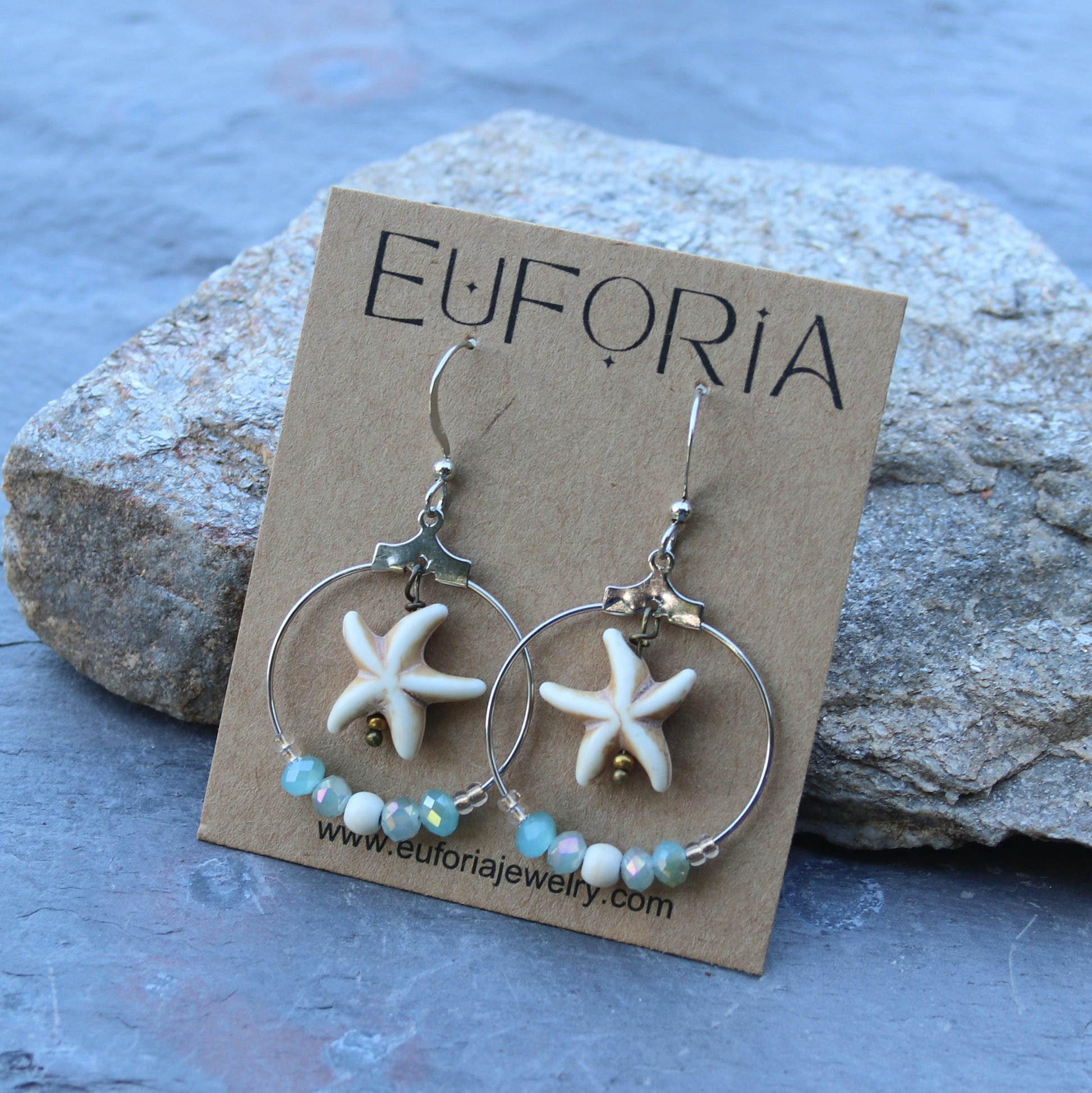 Dangle Earrings - bone colored resin starfish bead dangle inside a stainless steel beaded hoop