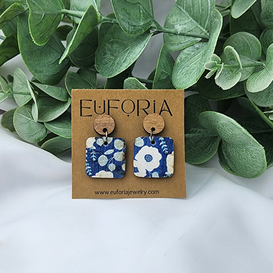 Cork over leather square earrings with round wood post. .75" squares white and light aqua floral over a denim blue field.