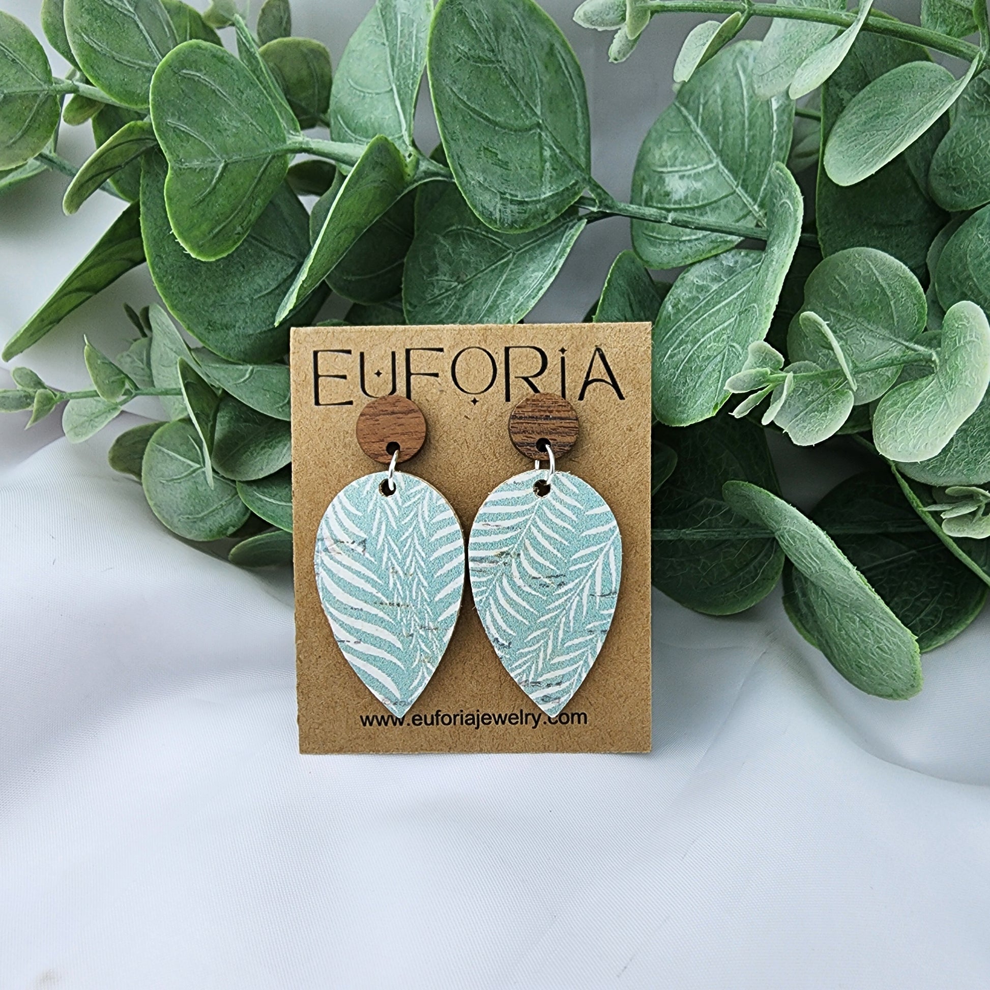 Cork over leather teardrop earrings with  round wood post.  White tropical leaf print over seafoam field.  