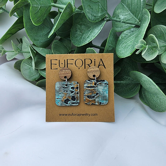 leather square earrings with round wood post. .75" squares in rustic driftwood print in aqua, bronze and charcoal.