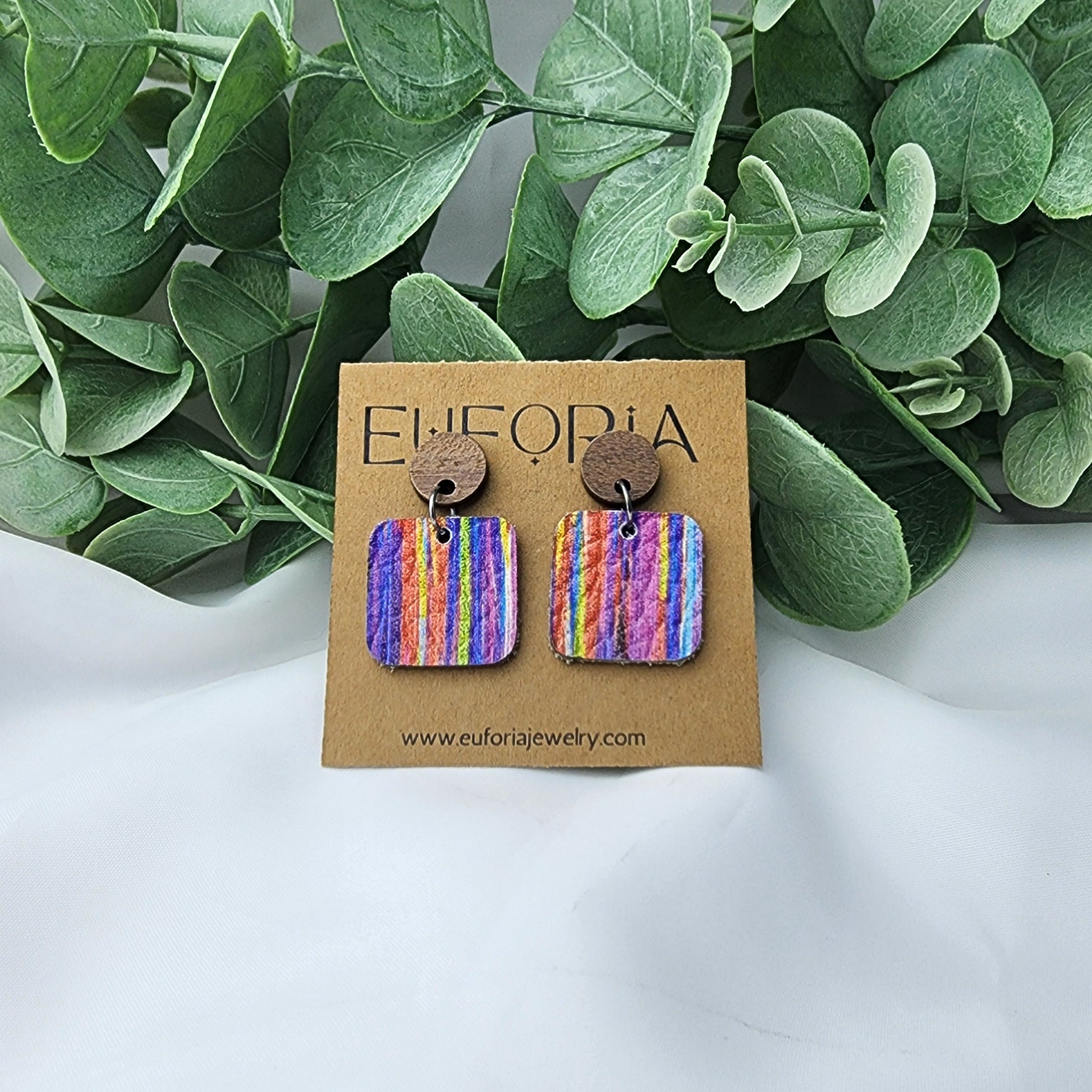 leather square earrings with round wood post. .75" squares in bright, multi-color artistic stripe pattern.