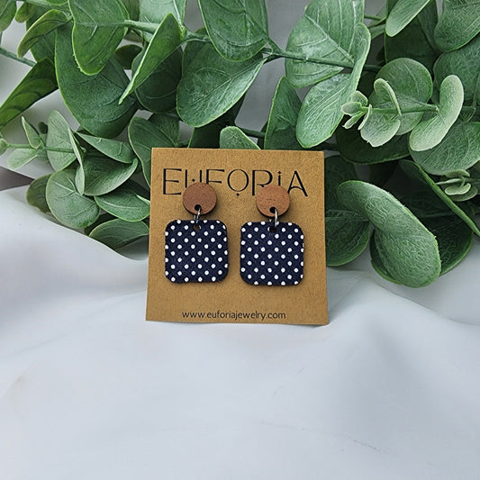 leather square earrings with round wood post. .75" squares in tiny white polka dots over navy.