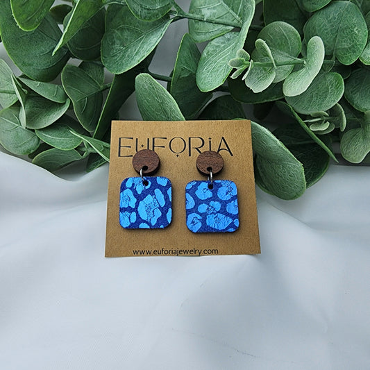 leather square earrings with round wood post. .75" squares in blue metallic leopard print.