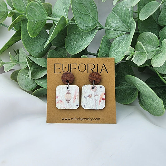 leather square earrings with round wood post. .75" squares in water color style stems and seed pods over white.