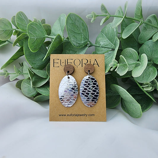 leather oval earrings with round wood post. 1.25" ovals with metallic silver snake print