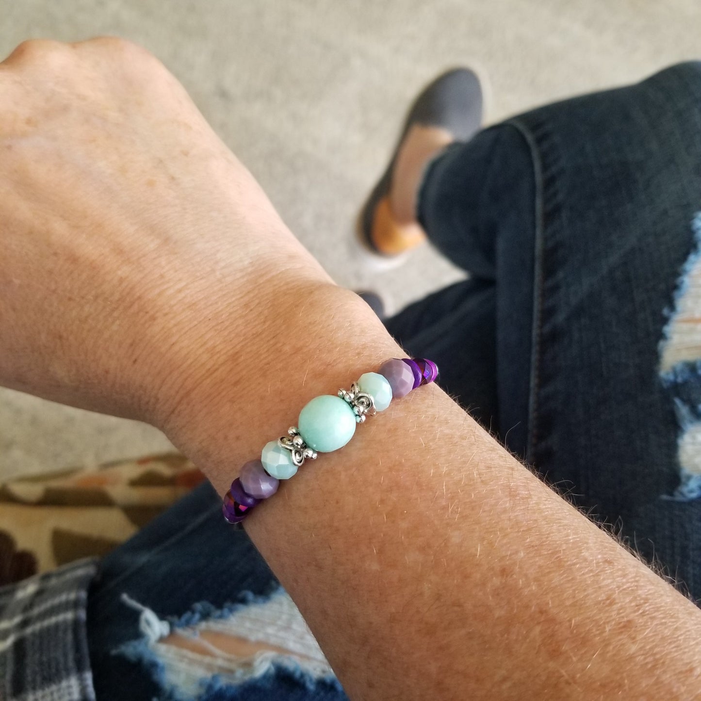 Seafoam riverstone with coordinating purple beads wrap bracelet on wrist