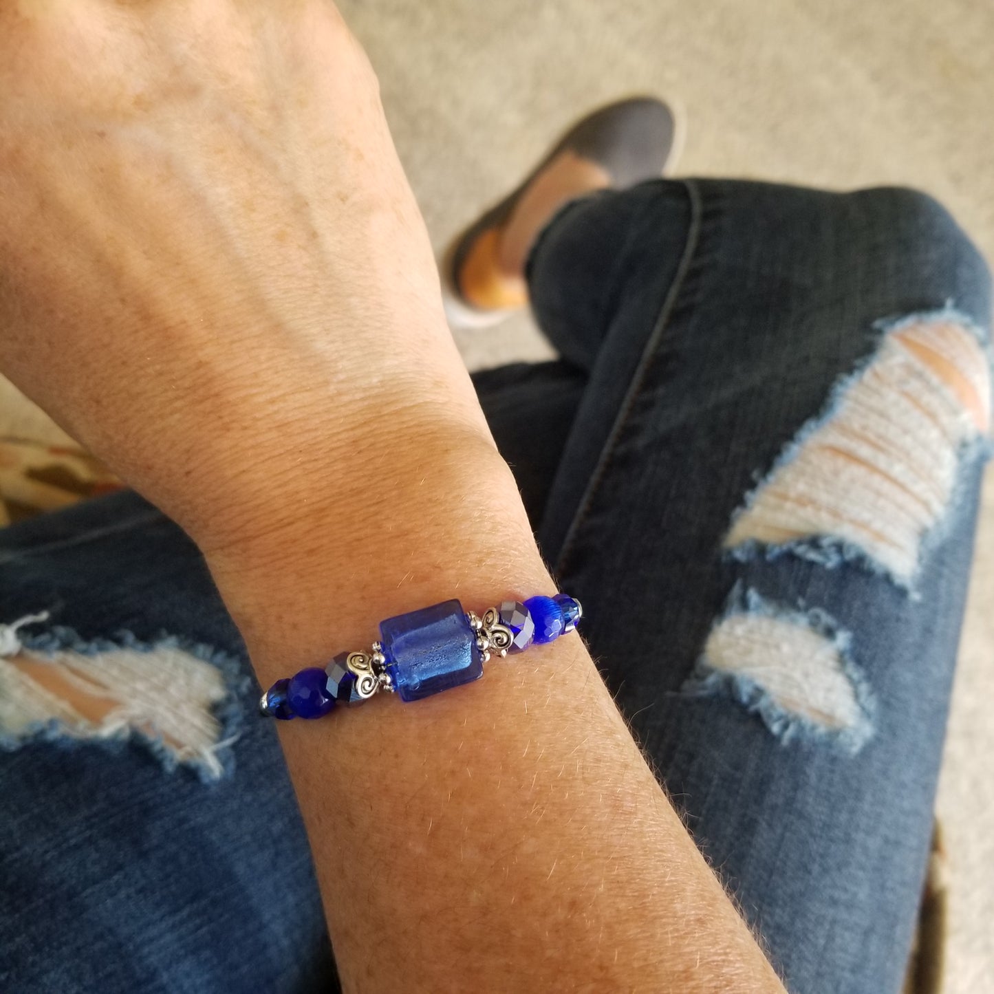 Cobalt blue foil bead and coordinating glass beads wrap bracelet on wrist