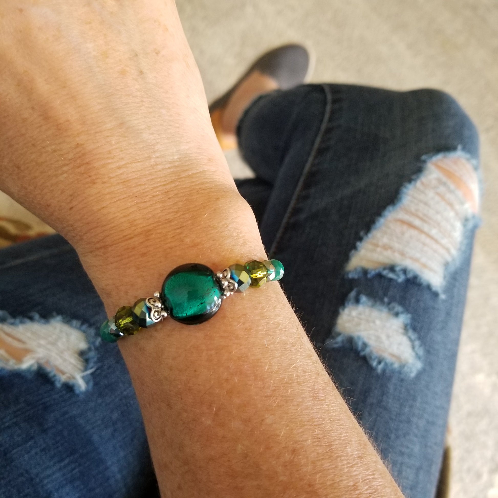 emerald green foil glass with coordinating glass beads wrap bracelet on wrist