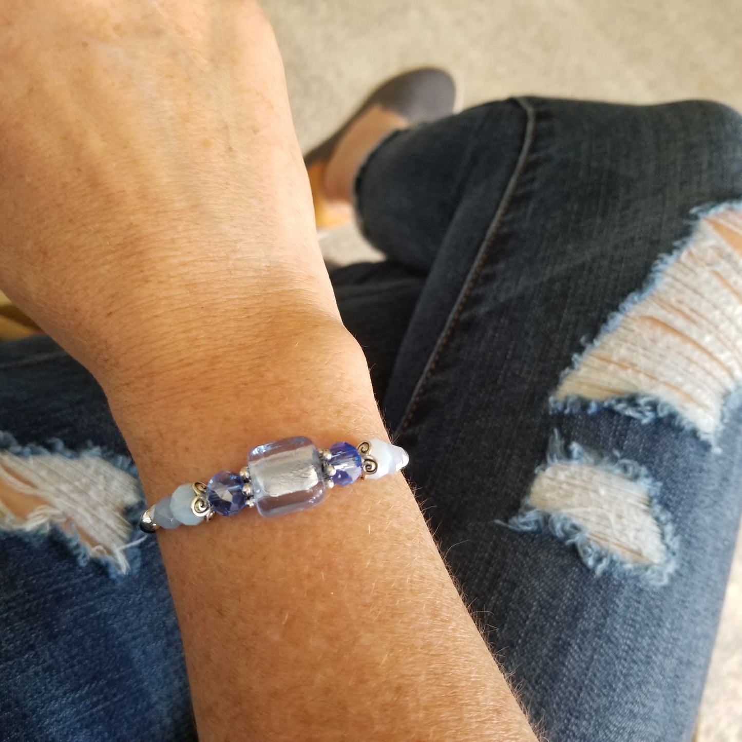Light Sapphire Foil Glass and coordinating glass beads wrap bracelet on wrist
