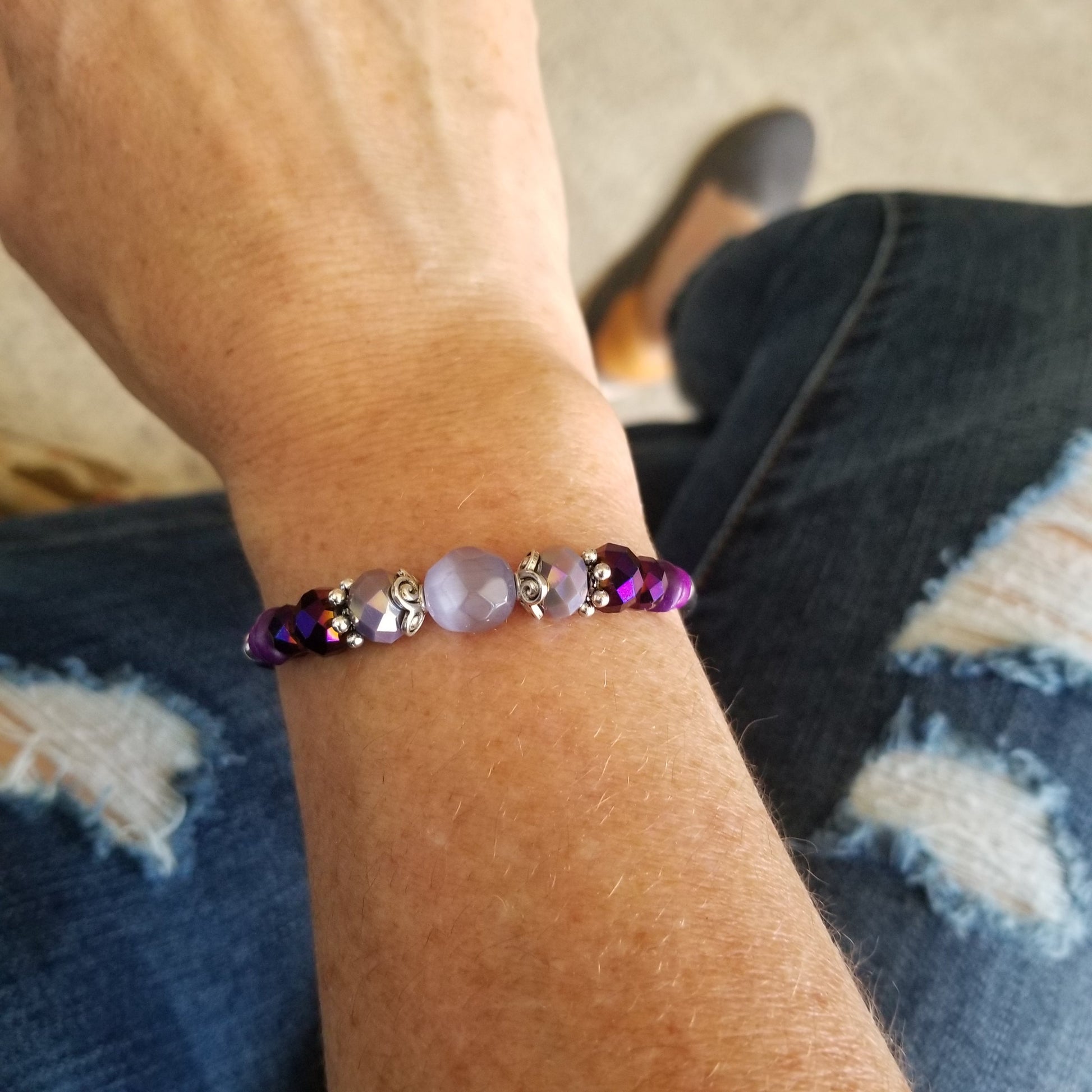 light purple cats eye and glass beads wrap bracelet on wrist
