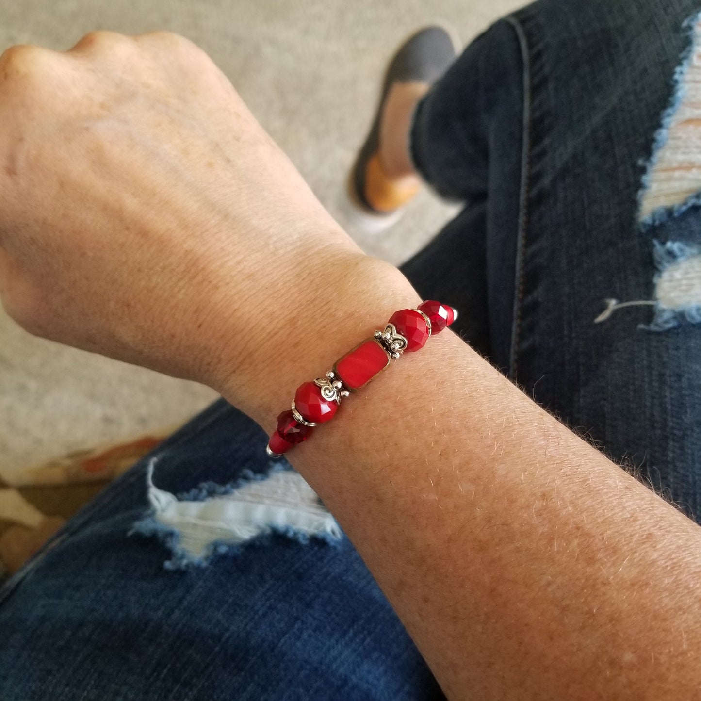Red glass beads wrap bracelet on wrist