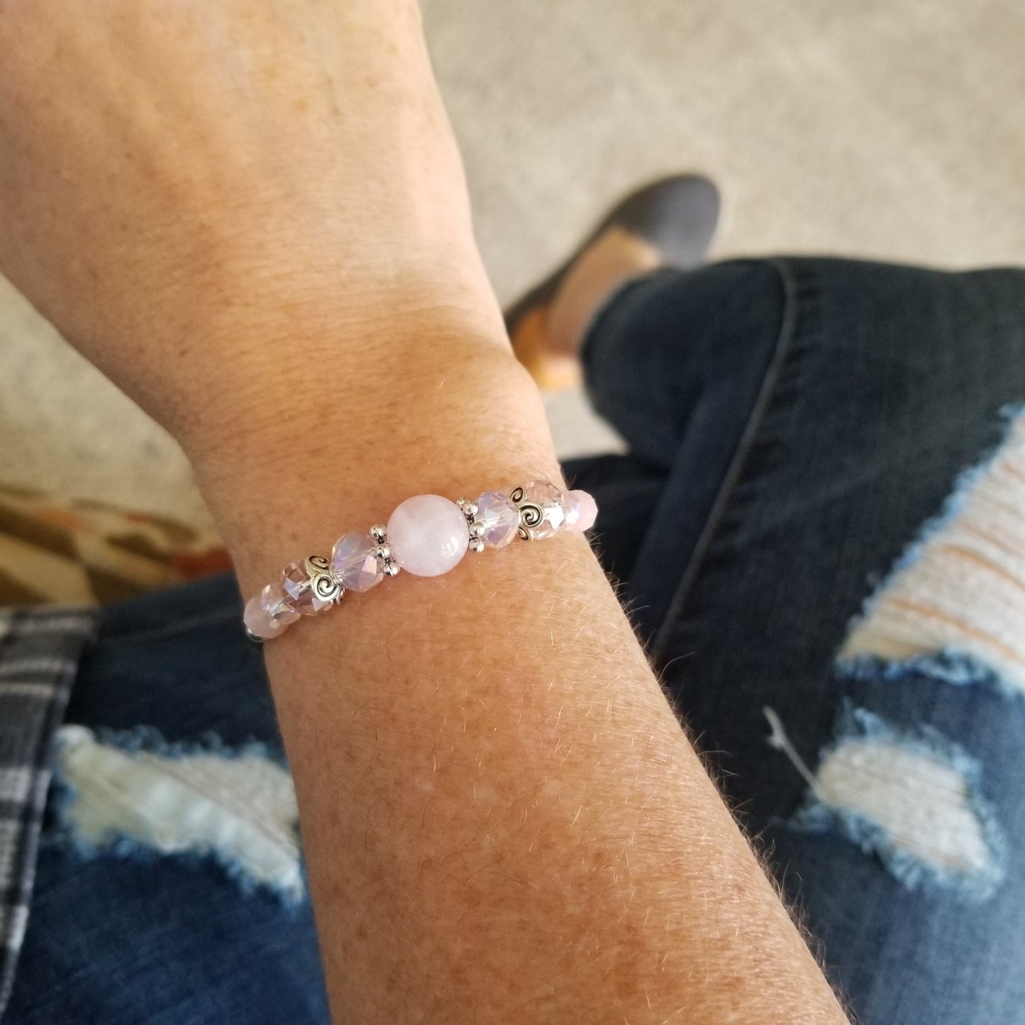 rose quartz and coordinating glass beads wrap bracelet on wrist