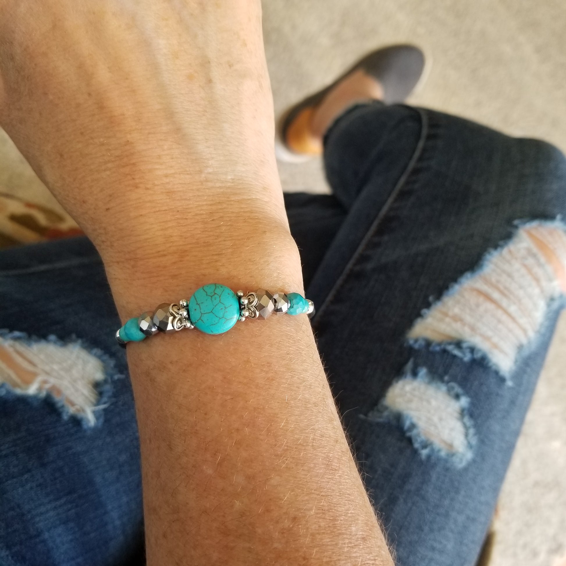 Turquoise and glass beads wrap bracelet on wrist